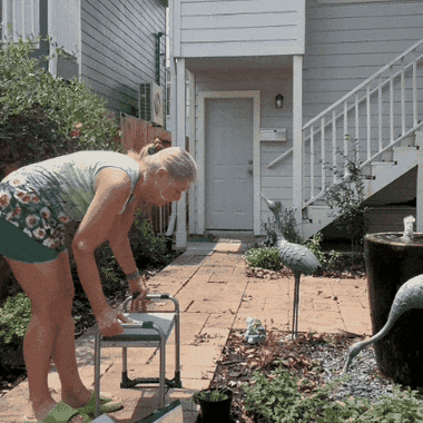 Sitting on the flipped kneeler at a raised bed